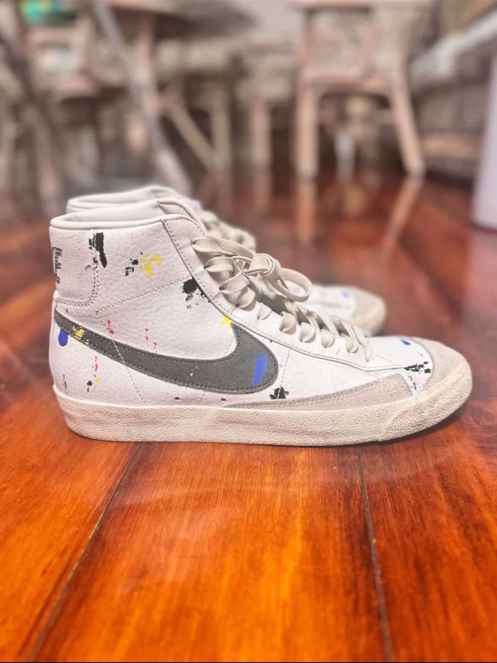 Nike Beige High-Top Sneakers with Gray Swoosh and Paint-Splatter Accents